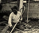Old Jake Jackson making snowshoe frames in his workshop in Teslin.