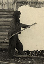 First Nations women scraping moose hide