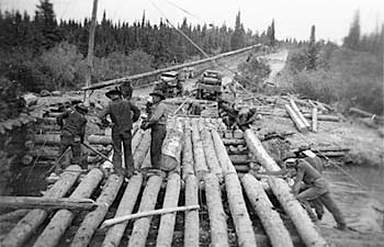 Men constructing timber bridge, 1942