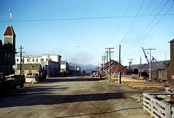 First Avenue in Whitehorse with the White Pass and Yukon Route station and train. ca. 1943-1944.