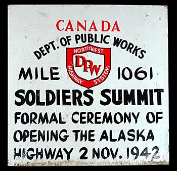 Painted by the federal Department of Public Works, this wooden sign shows the November, 1942 date of the official opening of the Alaska Highway.