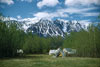 Pine Creek camp at Mile 1019 near Haines Junction. White canvas tents with snow-covered mountains in background.  1948