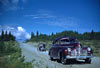 Two cars on the Alaska Highway at Mile 1017 near Haines Junction. 1948.