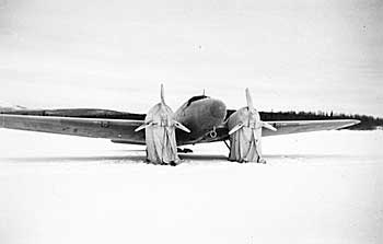 A RCAF Boeing 247 parked on the ice at Nisutlin Bay near Teslin