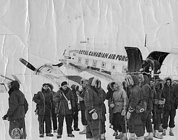 Group beside an RCAF Douglas C-47 "Dakota" plane