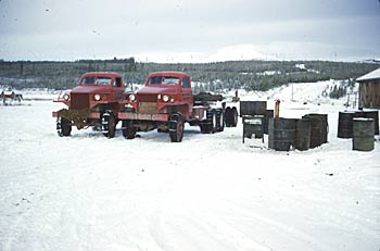 hauling pipe during the dismantling of the Canol pipeline.